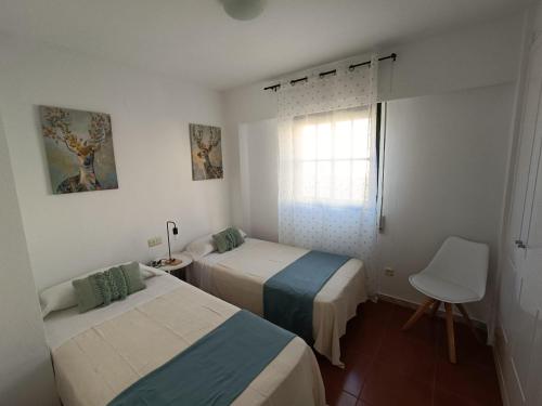 Postel nebo postele na pokoji v ubytování Urbanización Alcaudón premium by SIT ISLA CANELA