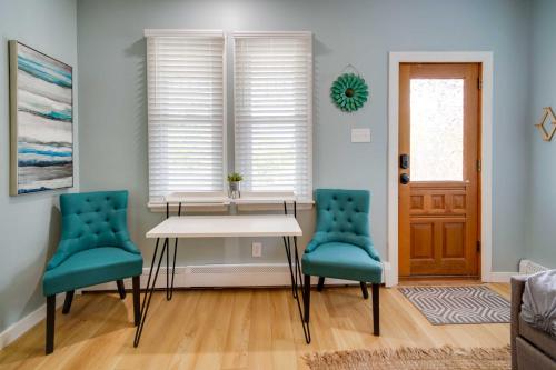 a dining room with a table and two chairs at Modern Ocean City Getaway Walk to Boardwalk! in Ocean City