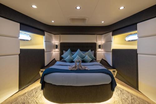 a master bedroom of a yacht with a large bed at Holiday yacht in Dubai in Dubai