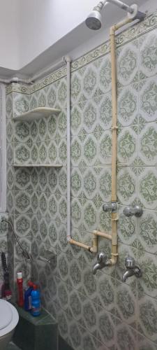 a bathroom with a shower and a sink at A home away from home in Kolkata