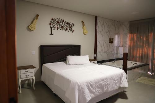 Postel nebo postele na pokoji v ubytování MIRANTE DO CERRADO