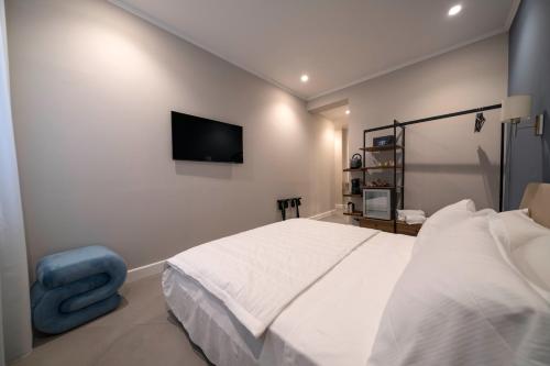 Ένα ή περισσότερα κρεβάτια σε δωμάτιο στο Porto Ercole Guest House