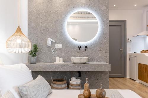 a bathroom with a sink and a mirror at Naxos Anamnisi in Plaka