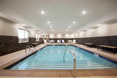 a large pool in a hotel room with at Country Inn & Suites by Radisson, Enid, OK in Enid