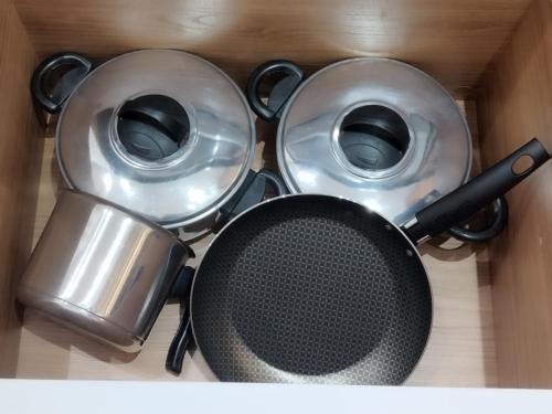 a box with two pans and a pot in it at C3 STUDIO in Rio de Janeiro