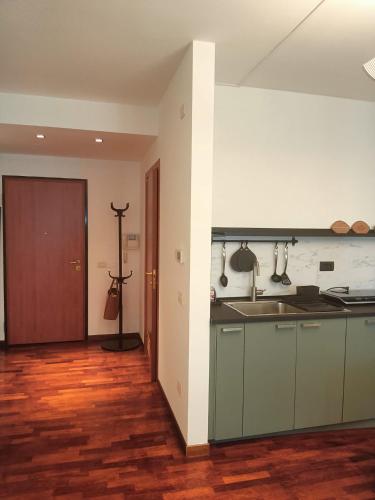 a kitchen with a sink and a counter top at Suite Alle Corti - Treviso in Treviso