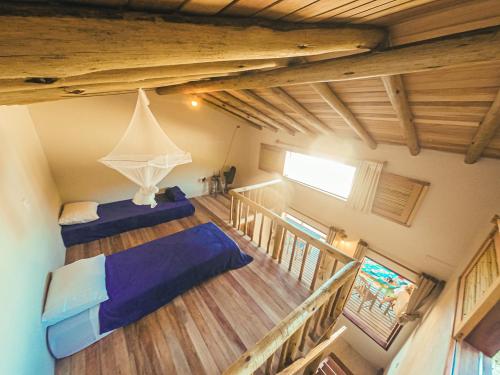 an overhead view of a room with two beds at Chalé na Praia de Ponta Negra in Ponta Negra