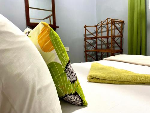 Кровать или кровати в номере Green's Hostel Nungwi