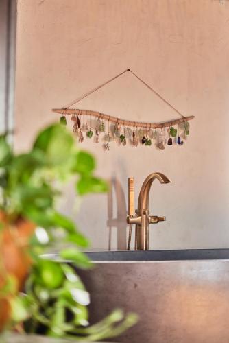 a kitchen sink with a faucet next to a sink at The Aerial, BVI in Tortola Island