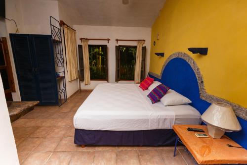 Postel nebo postele na pokoji v ubytování Posada El Jardin