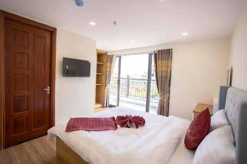 Postel nebo postele na pokoji v ubytování Thung Lũng Xanh TQK Hotel