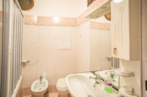 a bathroom with a sink and a toilet at Casa Donna Grazia - Cilento in Orria