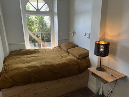 Säng eller sängar i ett rum på Appartement de charme Promenade Du Clair de Lune
