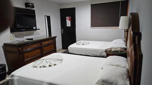 Postel nebo postele na pokoji v ubytování Hotel Colonial Cancun