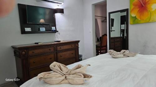 Postel nebo postele na pokoji v ubytování Hotel Colonial Cancun