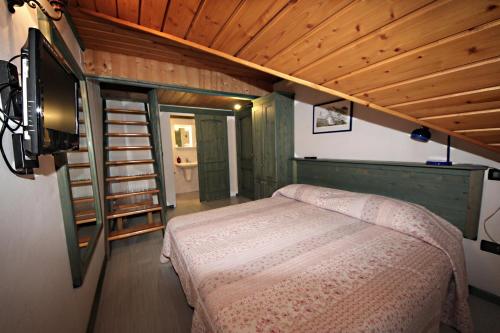 Postel nebo postele na pokoji v ubytování Albergo Diffuso Costauta