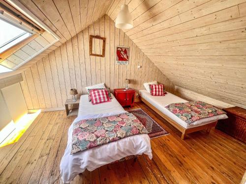 a room with two beds in a attic at Villa Étel, 4 pièces, 4 personnes - FR-1-479-83 in Étel