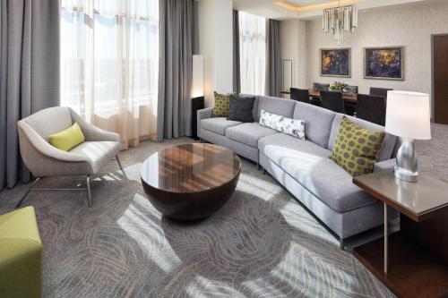 a living room with a couch and a table at The Westin Jackson in Jackson