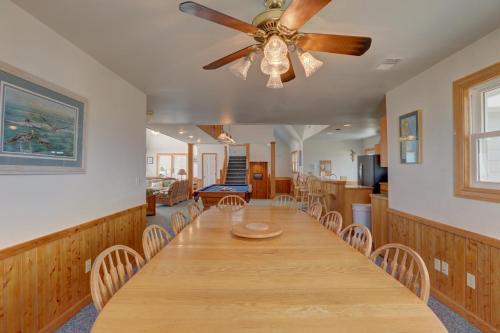 a dining room with a table and a ceiling fan at Play-N-Hooky Too #9-2 in Avon