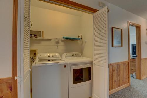 a kitchen with a stove and a white oven at Play-N-Hooky Too #9-2 in Avon