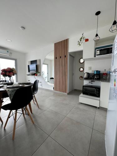 a kitchen and dining room with a table and chairs at Departamento en Corrientes in Corrientes