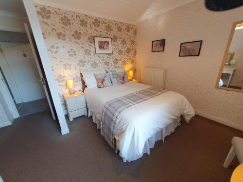 Katil atau katil-katil dalam bilik di Kirkcroft Guest House