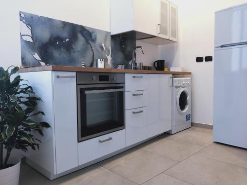 Kuchyň nebo kuchyňský kout v ubytování BARI 68 - Comfort moderno & fascino antico