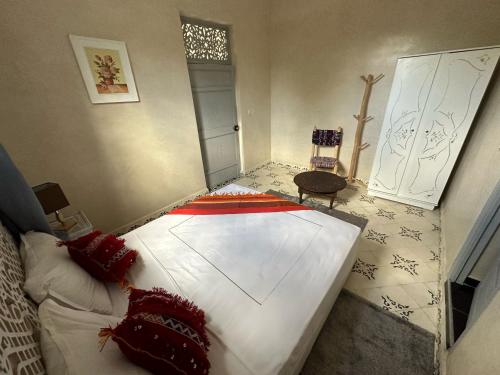 a bedroom with a large bed in a room at Oasis Merasi Marrakech in Marrakech