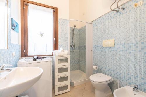 a bathroom with a sink and a toilet and a shower at Sa Perda 20 - FREE WIFI - 500mt from the beach in Costa Rei