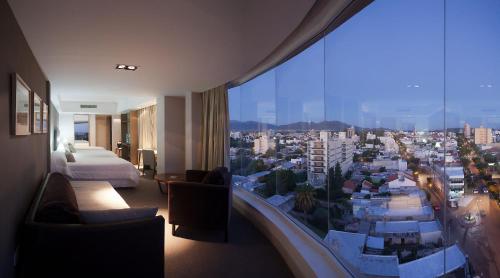 a hotel room with a view of a city at Visit Hotel & Apart in San Luis