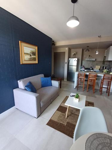 a living room with a couch and a table at Departamento Torre Murguía in San Salvador de Jujuy