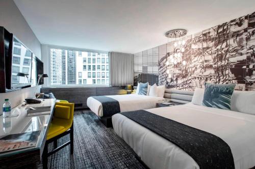 a hotel room with two beds and a large window at W Chicago - Lakeshore in Chicago