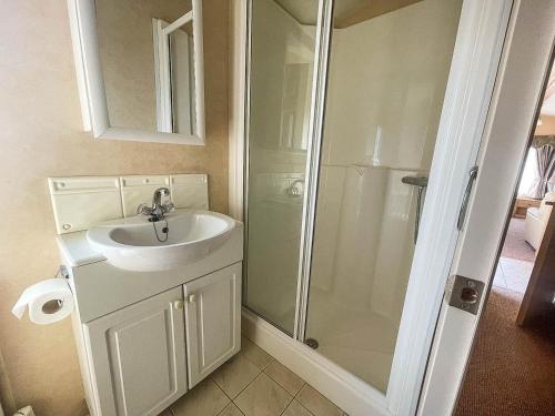 a bathroom with a sink and a shower at 4 Berth Nearby Hunstanton Beach In Norfolk Ref 13018l in Hunstanton