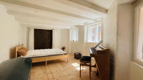 a bedroom with a bed and a desk in it at ApartmentInCopenhagen Apartment 1541 in Copenhagen