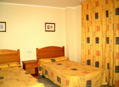 Postel nebo postele na pokoji v ubytování APCOSTAS - San Antonio