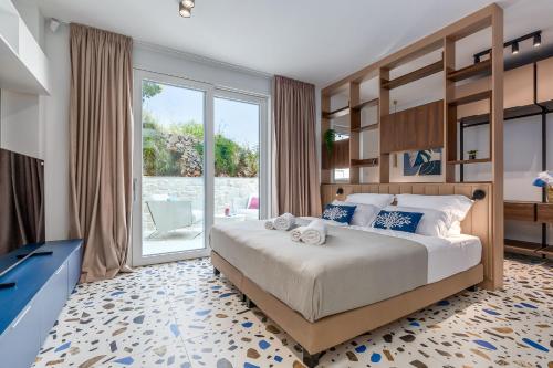 Ένα ή περισσότερα κρεβάτια σε δωμάτιο στο Villa Miramarina