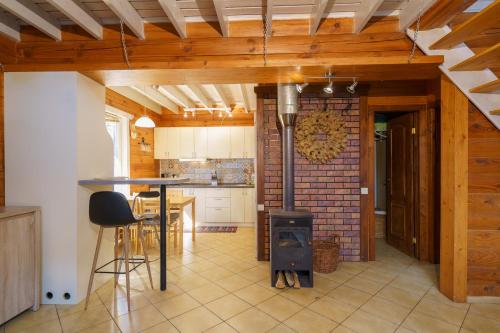 a kitchen with a stove in the middle of a room at Ekodom in Voropayev