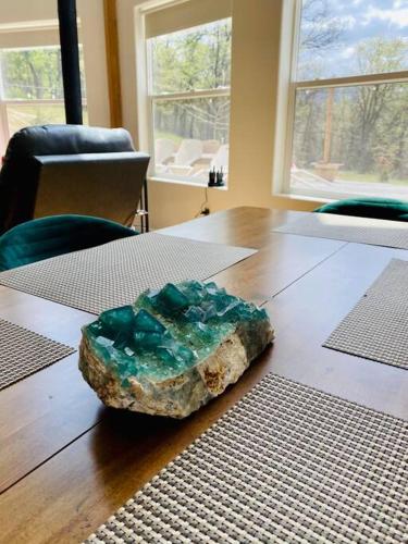 a rock sitting on top of a wooden table at Modern House on 5 acr in Sequoia National Forest in Panorama Heights