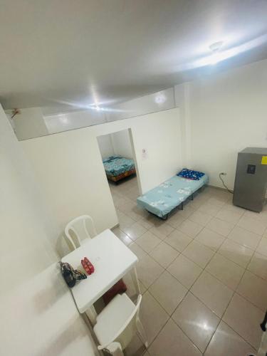 Postel nebo postele na pokoji v ubytování Casa de Huéspedes Playas Arena