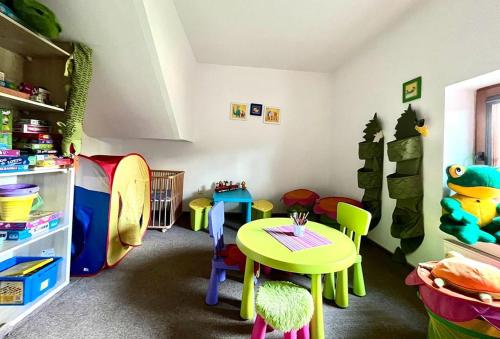 a childs play room with a table and chairs at Willa Julia in Karwia