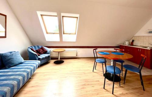 a living room with a couch and a table at Willa Julia in Karwia