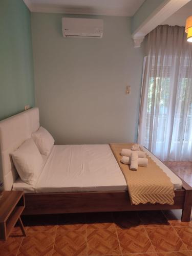 a bedroom with a bed with two towels on it at Amaya Pine Studio in Panayia