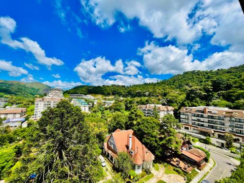 a view of a city with buildings and trees at Studio luxo Granja Brasil Green Mountain flat - Itaipava in Itaipava