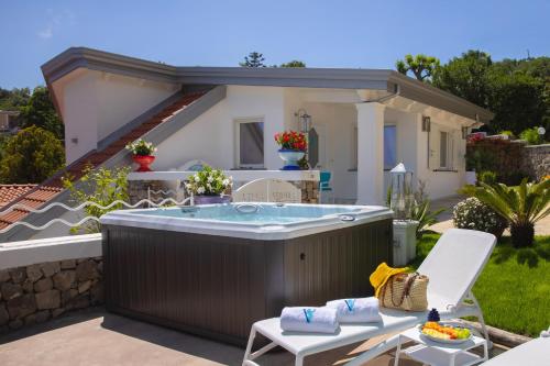 a hot tub in the backyard of a house at Villa Veronica Luxury Suite in Amalfi coast in Piano di Sorrento