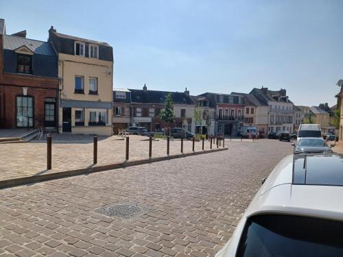 a cobblestone street in a town with buildings at studio9 in Ault