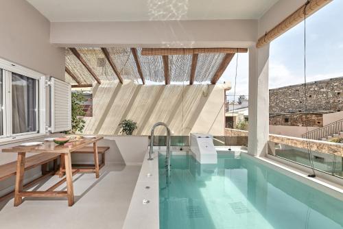 The swimming pool at or close to 2 bedroom Villa with heated swimming pool-Spa whirlpool-BBQ!