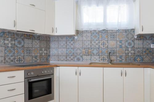 Dapur atau dapur kecil di Anesis Seaview Apartment