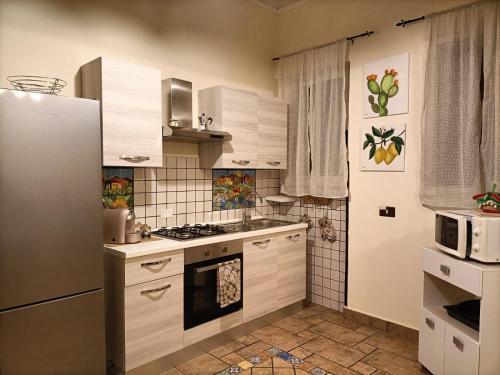 Kuchyň nebo kuchyňský kout v ubytování La Sicilia in casa