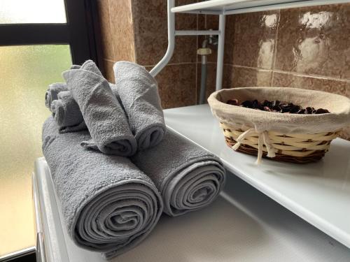 a pile of towels on a counter in a bathroom at Casa Tino in Murazzano
