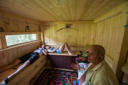 two people laying in the inside of a sauna at Апартаменти БАРВА in Beloberëzka